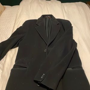 A black, long pea coat. The original teller coat